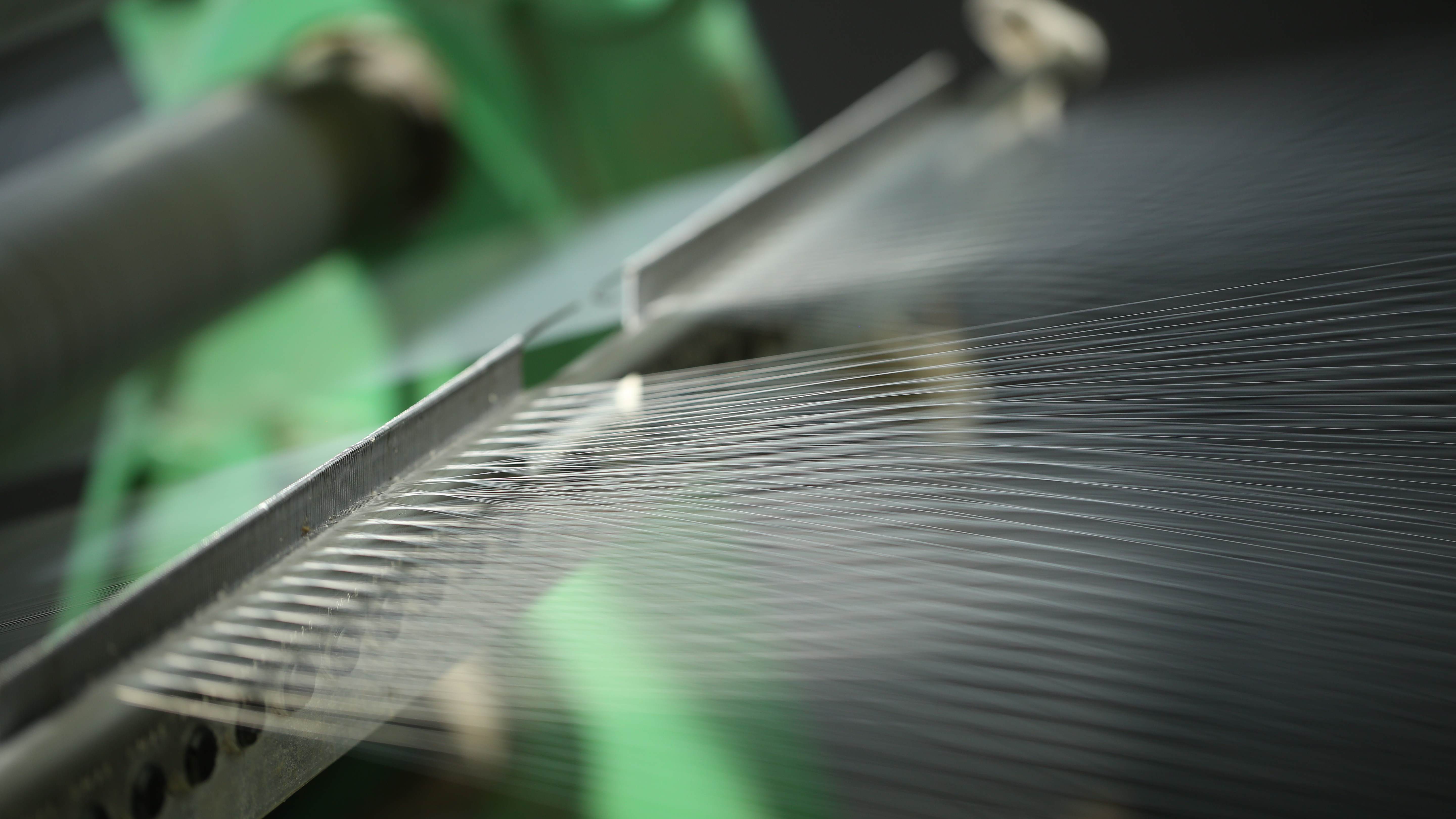 close up of fibre being spun in machine