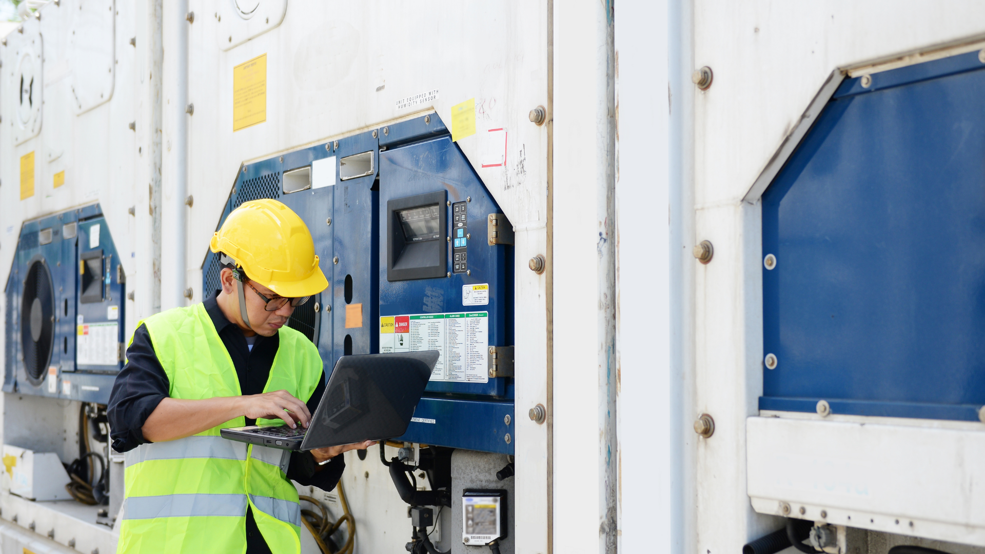 Technician monitoring cold chain logistics temperature following application of phase change materials